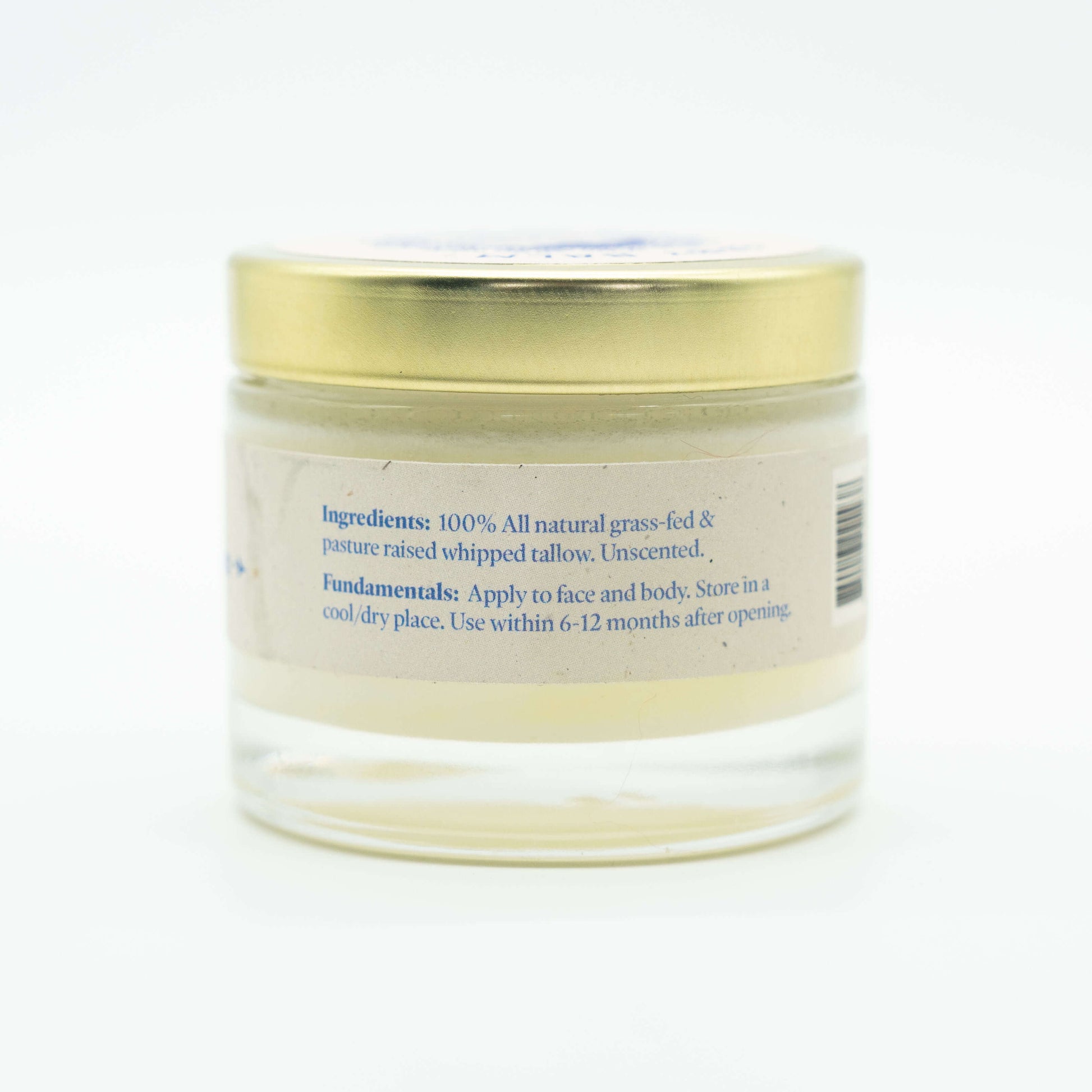 Side view of a jar of Western Provisions organic tallow baby balm showing ingredients
